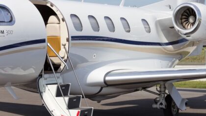 Embraer 505 Phenom 300 Light Business Jet on runway with door open